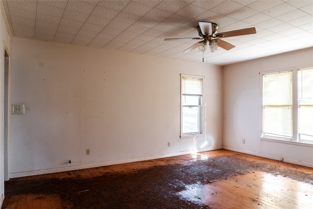 spare room with a healthy amount of sunlight and ceiling fan