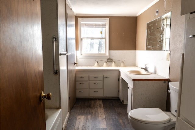 bathroom featuring hardwood / wood-style floors, decorative backsplash, vanity, ornamental molding, and toilet