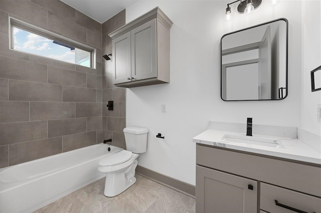 full bathroom with vanity, toilet, and tiled shower / bath