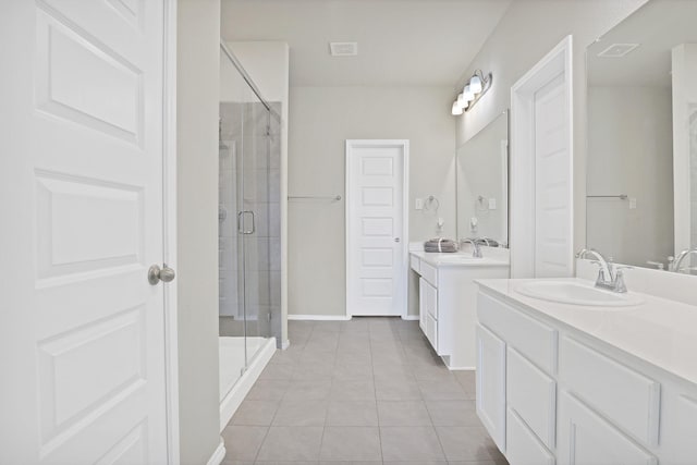 bathroom featuring vanity, tile patterned floors, and an enclosed shower