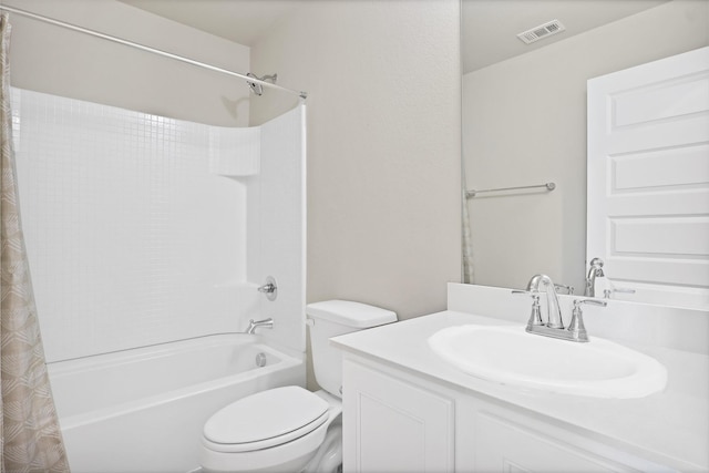 full bathroom featuring shower / bath combo with shower curtain, vanity, and toilet