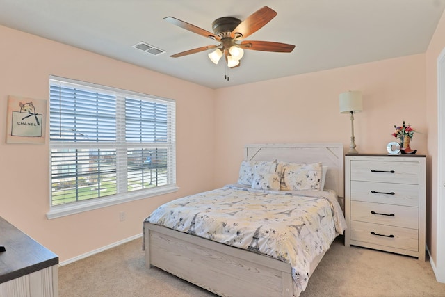 bedroom with light colored carpet and ceiling fan