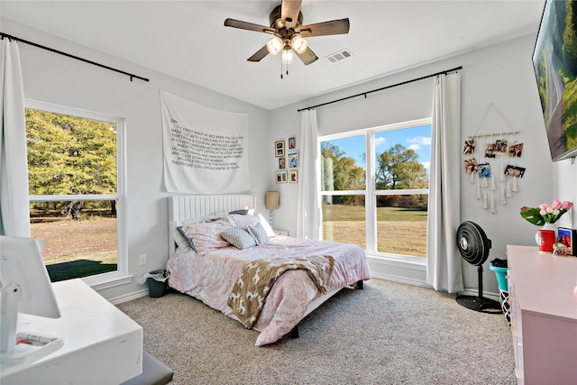 carpeted bedroom with ceiling fan