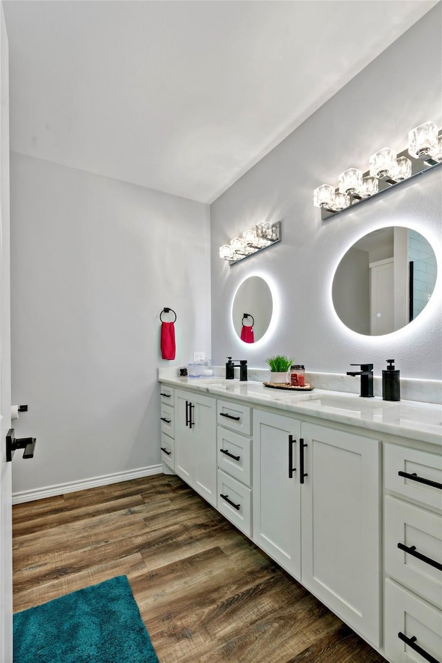 bathroom featuring wood-type flooring and vanity