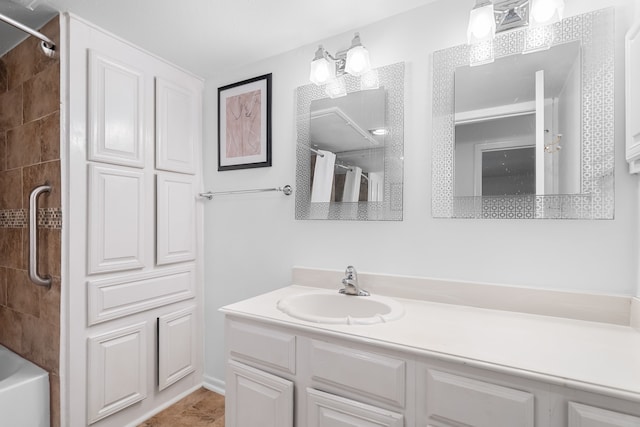 bathroom with vanity and tiled shower / bath combo