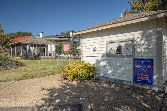 view of side of property with a lawn