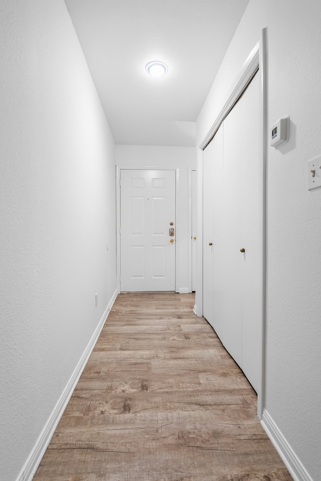 corridor featuring light wood-type flooring