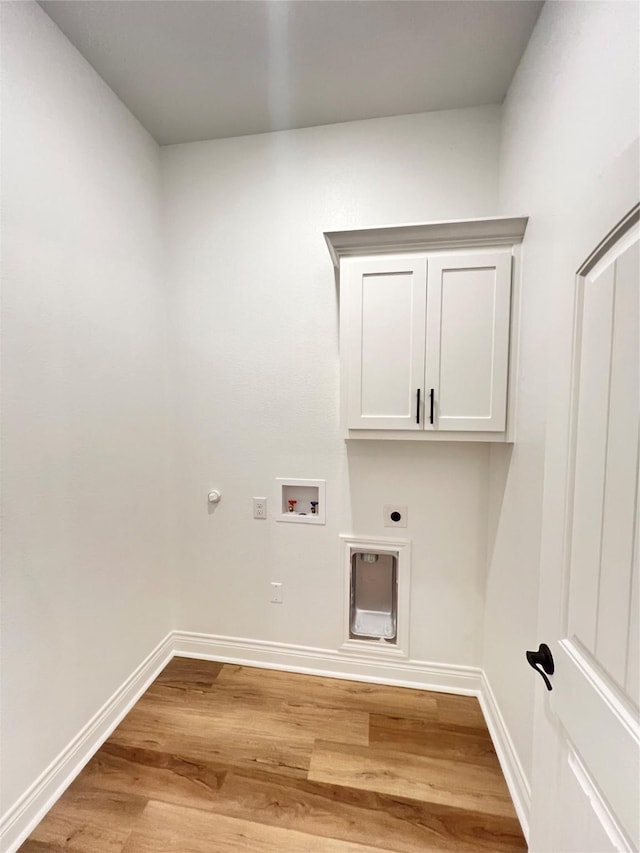 laundry room with gas dryer hookup, hookup for a washing machine, light hardwood / wood-style flooring, and hookup for an electric dryer