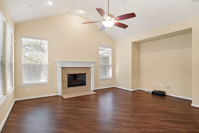 unfurnished living room with a fireplace, dark wood-type flooring, and lofted ceiling