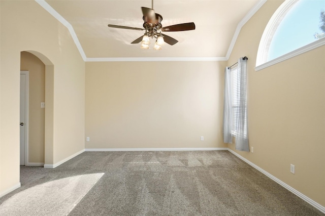 spare room with light colored carpet, ceiling fan, and ornamental molding