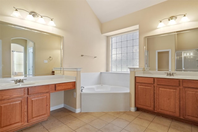 bathroom with tile patterned floors, vanity, lofted ceiling, and independent shower and bath