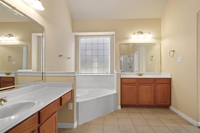 bathroom featuring tile patterned floors, vanity, and separate shower and tub