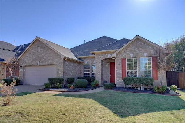 view of front of house with a garage and a front lawn