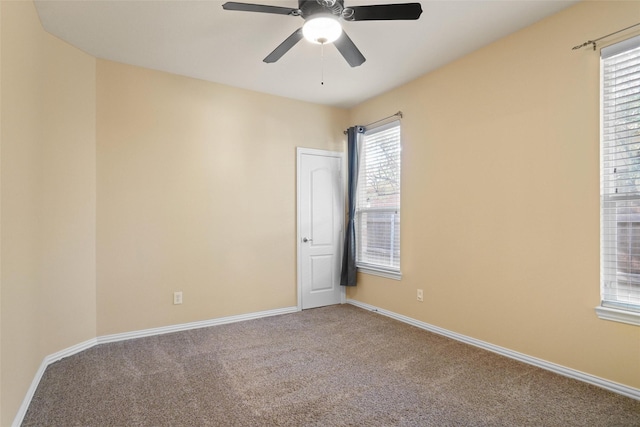 carpeted empty room with ceiling fan