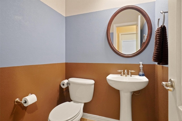 bathroom featuring sink and toilet