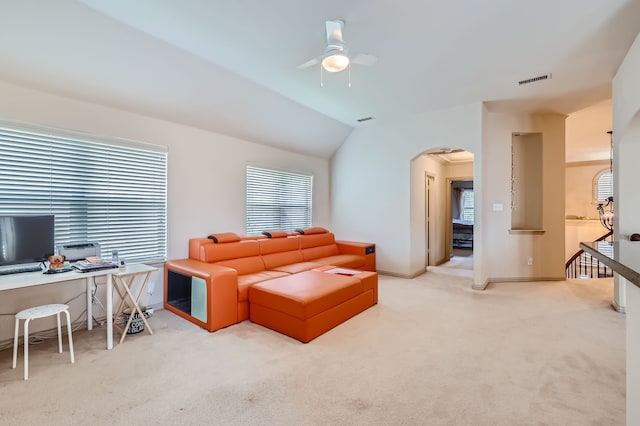 carpeted living room with vaulted ceiling and ceiling fan