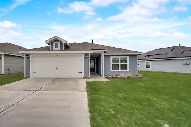 ranch-style house featuring a garage and a front yard