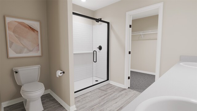 bathroom with vanity, wood-type flooring, toilet, and walk in shower