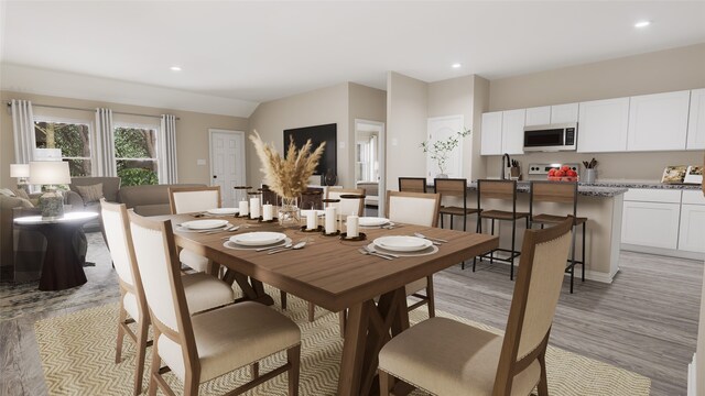 dining room with light wood-type flooring