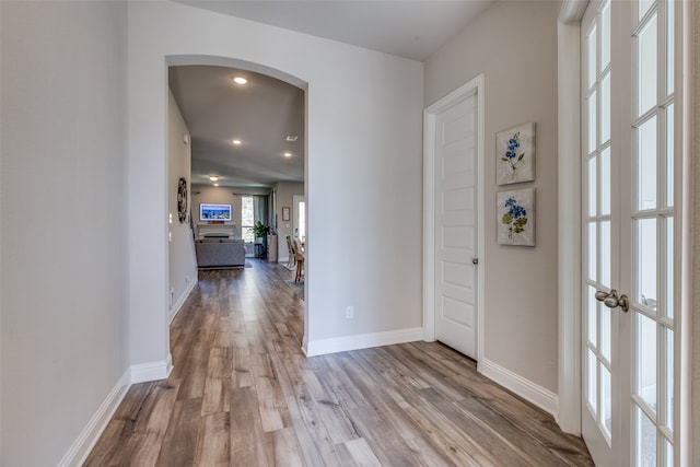 corridor with light wood-type flooring