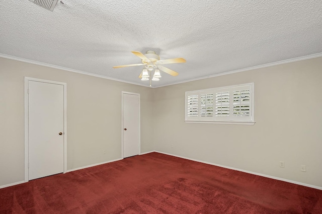 empty room featuring crown molding, ceiling fan, carpet floors, and a textured ceiling