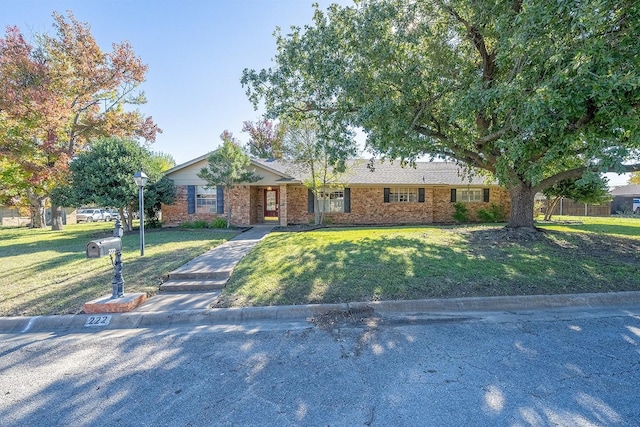 ranch-style home with a front yard