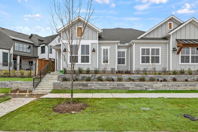 doorway to outside featuring a wealth of natural light, light hardwood / wood-style floors, and vaulted ceiling