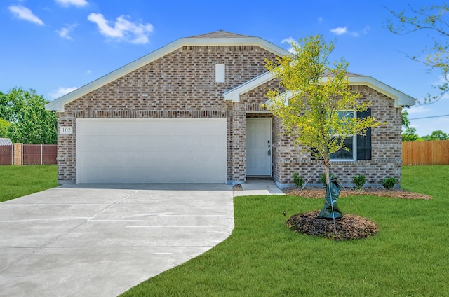 view of front of house with a front yard and a garage