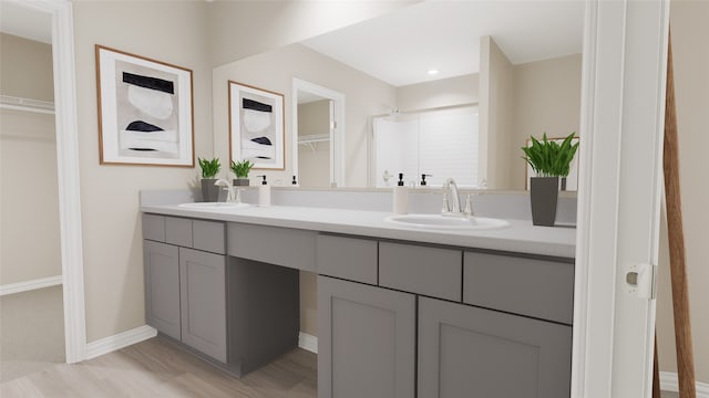 bathroom with hardwood / wood-style floors and vanity