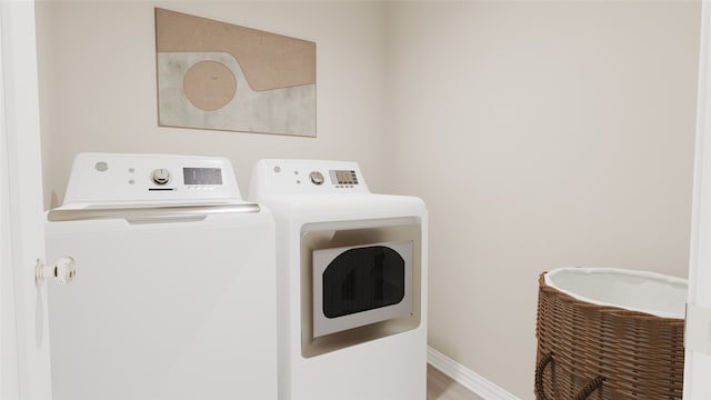 laundry room with separate washer and dryer