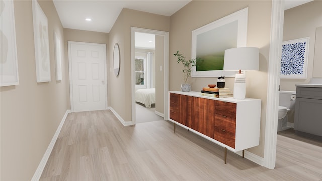 interior space featuring hardwood / wood-style floors and toilet