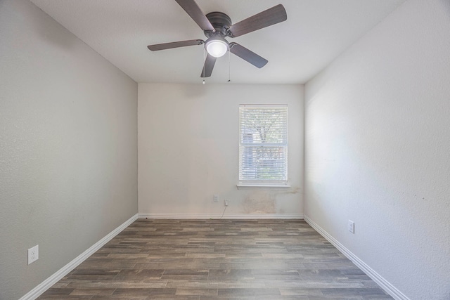 spare room featuring ceiling fan and wood-type flooring