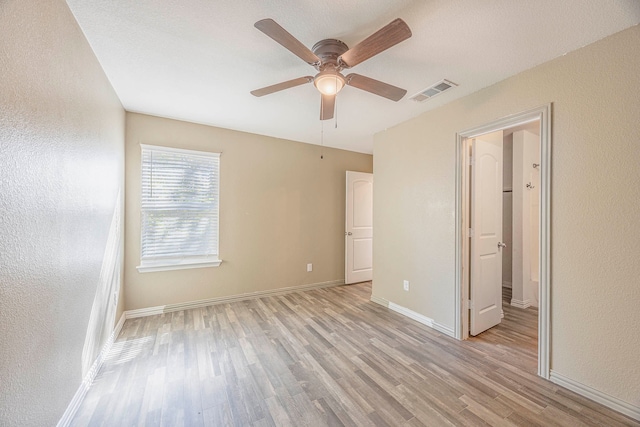 unfurnished bedroom featuring ceiling fan and light hardwood / wood-style flooring