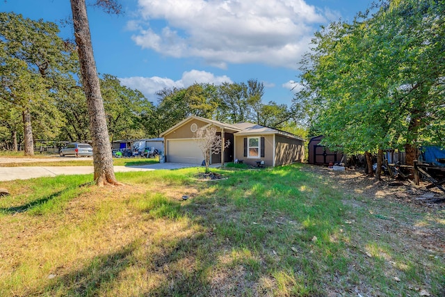 single story home featuring a front lawn and a garage