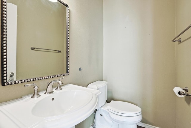 bathroom with sink and toilet