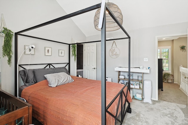 carpeted bedroom with vaulted ceiling