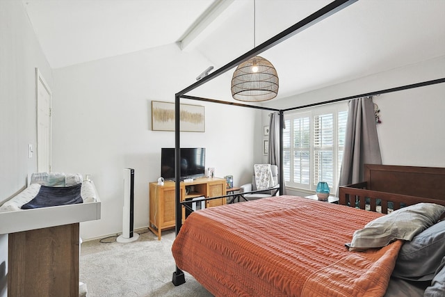 carpeted bedroom with lofted ceiling with beams