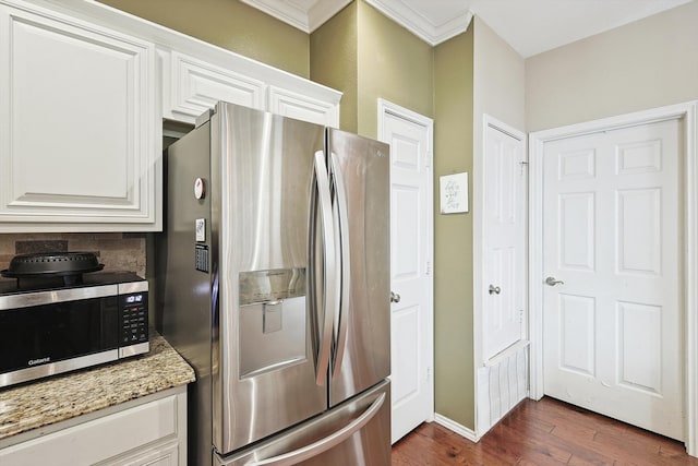 kitchen featuring light stone counters, dark hardwood / wood-style floors, white cabinets, and appliances with stainless steel finishes