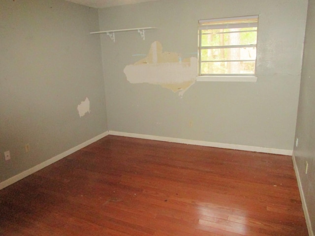 unfurnished room featuring hardwood / wood-style flooring