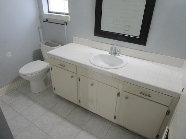 bathroom with tile patterned floors, vanity, and toilet