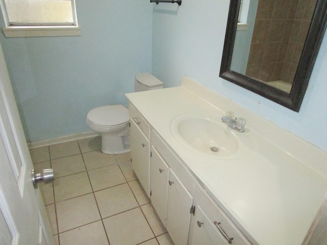 bathroom with tile patterned floors, vanity, and toilet