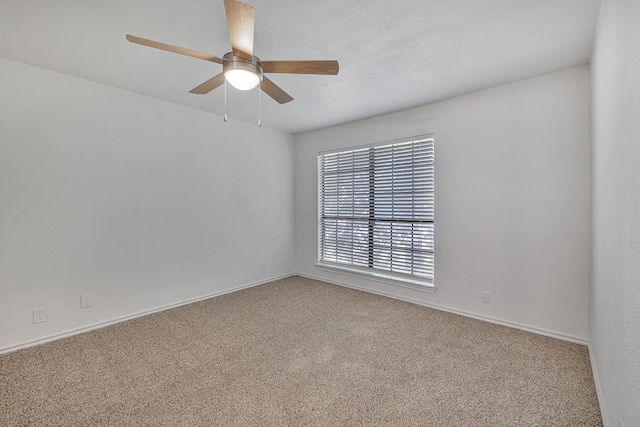 unfurnished room featuring carpet flooring and ceiling fan