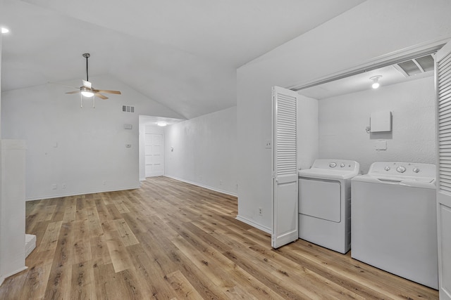 laundry room featuring washer and dryer, ceiling fan, and light hardwood / wood-style flooring