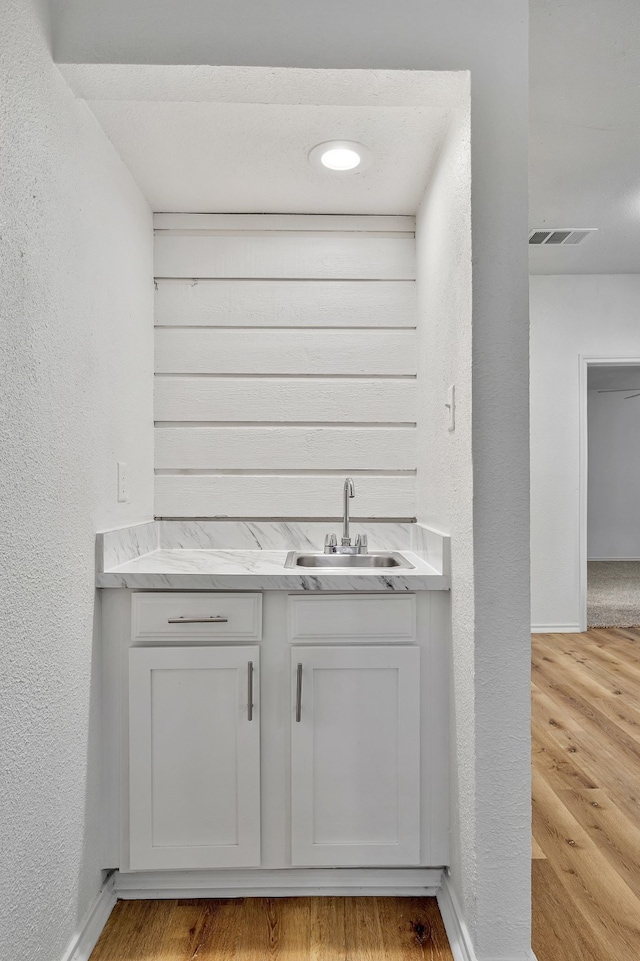 bathroom featuring vanity and hardwood / wood-style flooring