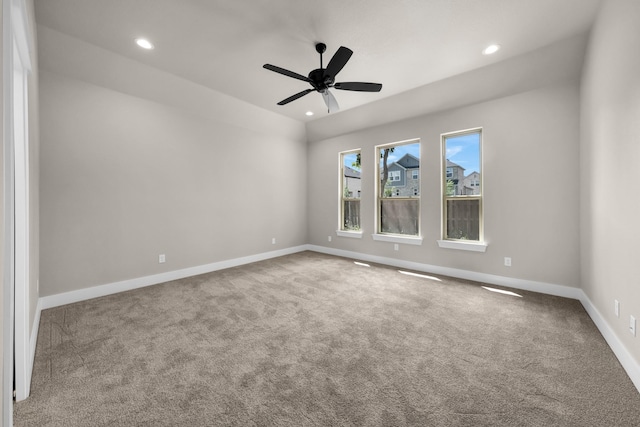 empty room with ceiling fan and carpet flooring