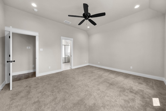 unfurnished bedroom with vaulted ceiling, ceiling fan, and carpet flooring