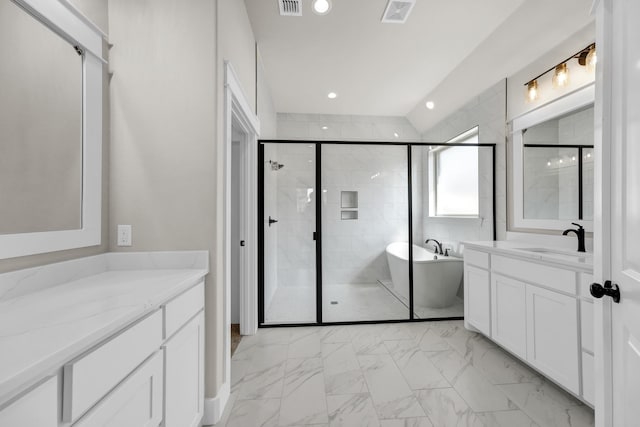 bathroom with vanity and independent shower and bath