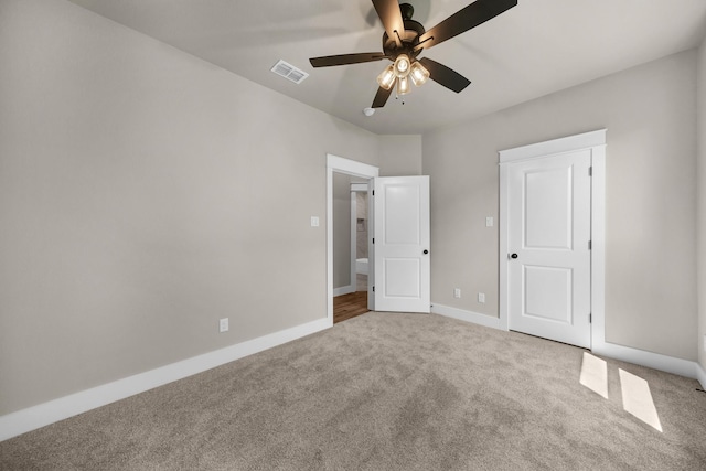 unfurnished bedroom with ceiling fan and carpet flooring