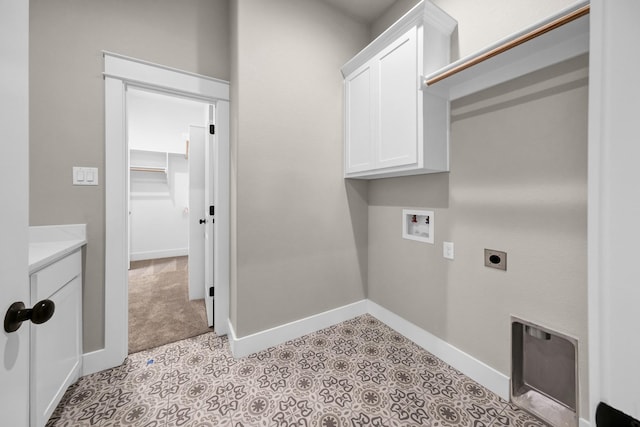 washroom featuring cabinets, washer hookup, and hookup for an electric dryer