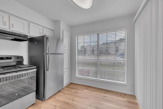 kitchen with white cabinetry, appliances with stainless steel finishes, a textured ceiling, and light hardwood / wood-style flooring